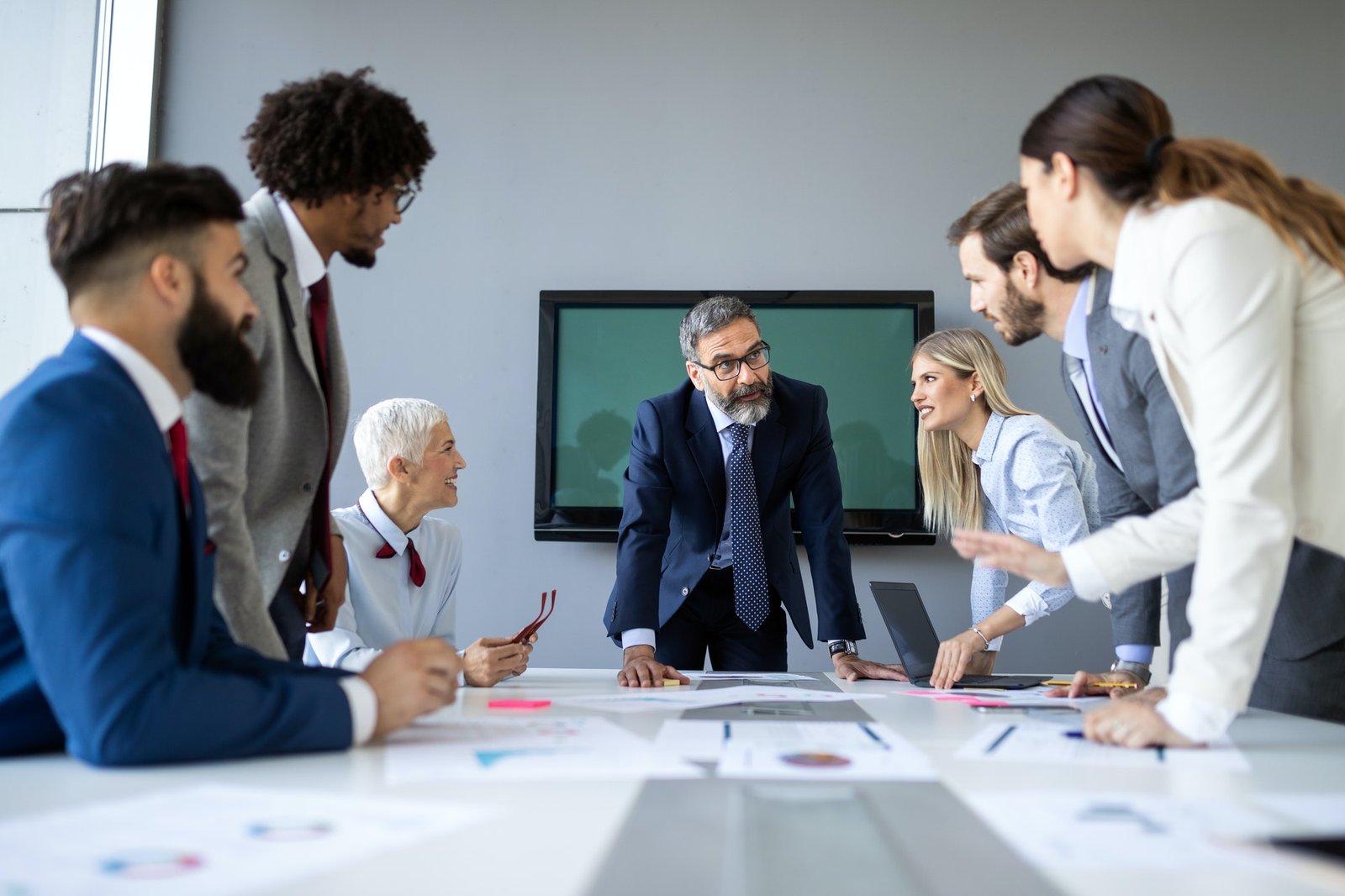 Successful team leader and business owner leading informal in-house business meeting