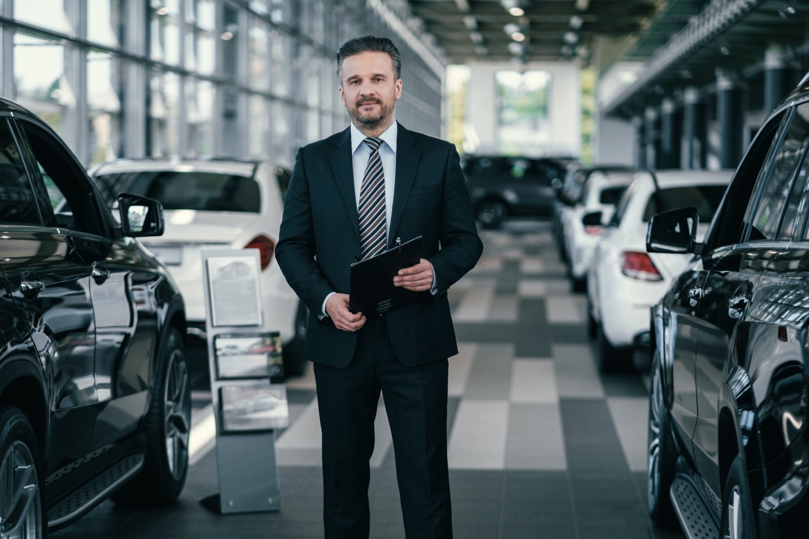 Top sales manager at dealership showroom